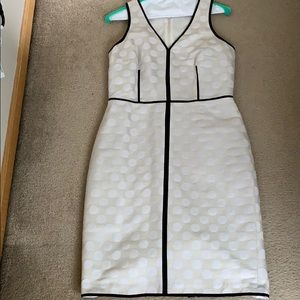 Tan and white polka dot with black piping dress